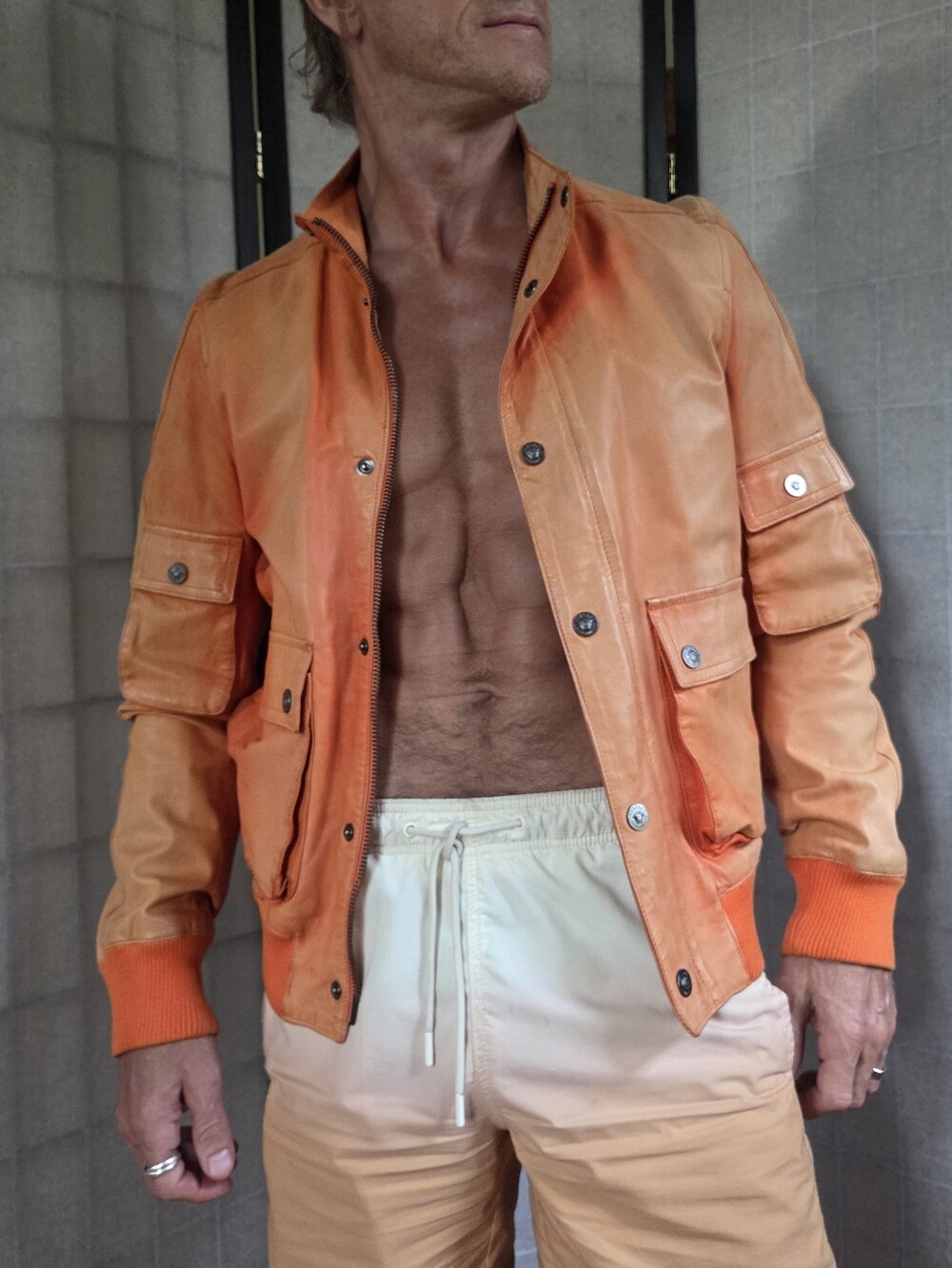 Men's Orange Leather Bomber Jacket with Snap Pockets